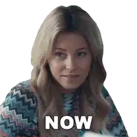 a woman in a colorful shirt says " now "