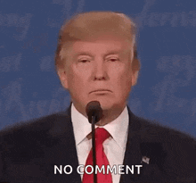 donald trump is giving a speech at a debate and says no comment .