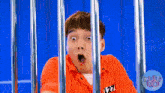a man in a jail cell with a number 127 on his shirt