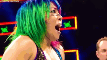 a pixelated image of a woman with green hair and the words " greatest big thing " on the bottom