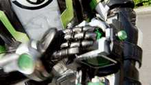 a close up of a person wearing a green glove