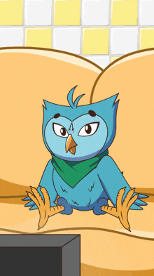 a cartoon owl with a green scarf around its neck is sitting on a couch