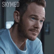 a close up of a man 's face with the words skymed written above him