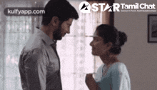 a man and a woman are looking at each other with a star tamil chat logo in the corner