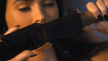 Unsheathing The Knife Megan Fox GIF - Unsheathing The Knife Megan Fox The Expendables 4 GIFs