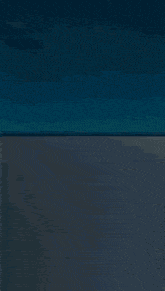 a blue background with a glowing light coming out of it