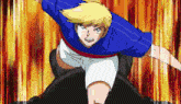 a boy in a blue shirt and white shorts is jumping in the air .