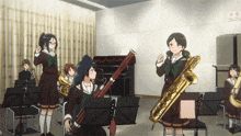 a girl holding a saxophone in a band room