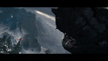 a dragon is flying over a mountain with a rocket coming out of it 's mouth