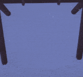 a husky penguin is sitting on a swing in the snow