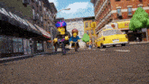 two lego characters are riding bicycles down a city street