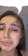 a close up of a woman 's face with a speech bubble in the background .