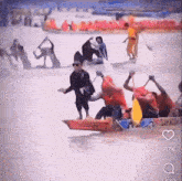 a group of people in a canoe with the number 917k on the bottom of the screen