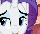 a close up of a pony with a purple mane