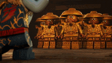 a group of lego figures are standing in a line