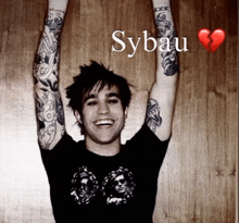a young man with his arms in the air with sybau written on the bottom