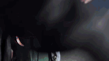 a person is holding a blue object in their hand .