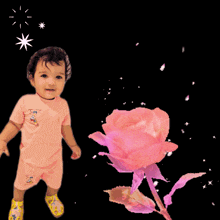 a baby standing next to a pink rose with the words amazing voice and singing
