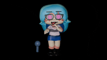 a figurine of a girl with blue hair and pink eyes
