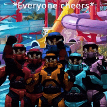 a group of soldiers standing in front of a water slide with the words everyone cheers