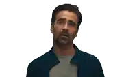 a man with a beard and a blue jacket is looking up
