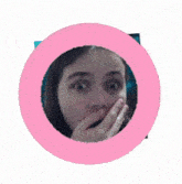 a picture of a woman covering her mouth with her hand in a pink circle