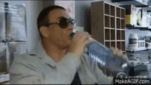 Jean Claude Van Damme Drink GIF - Jean Claude Van Damme Drink GIFs