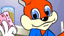 a cartoon fox is holding a pink sponge in front of a glass of orange juice
