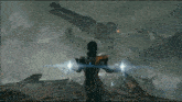 a man in a white suit is standing in front of a mountain with a lightning bolt coming out of it .