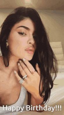 a woman with a ring on her finger and the words happy birthday