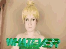 a woman in a tinkerbell costume is standing in front of a sign that says whatever
