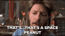 a man with long hair and a beard is talking about a space peanut .