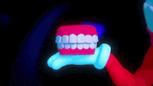 a cartoon character is holding a model of teeth in his hand