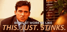 a man in a suit and tie is making a funny face and saying `` being at work be like this just stinks ''