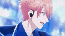 a close up of a person with pink hair wearing ear buds