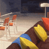 a living room with a couch and chairs and a lamp on the floor
