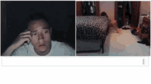 a man in a white shirt is talking on a cell phone