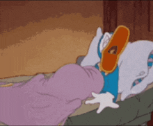 a cartoon of donald duck laying in bed with his mouth open .