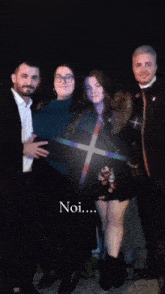a group of people are posing for a picture with the words noi written below them