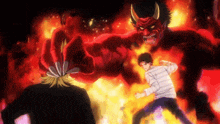 a man is standing in front of a large red monster