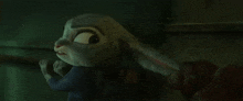 a cartoon rabbit is standing in a dark room with its ears spread out .