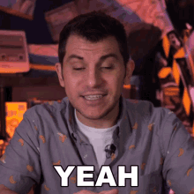 a man in a banana shirt says yeah in white letters