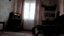 a living room with a flat screen tv and a couch