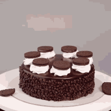 a chocolate cake with oreo cookies on top