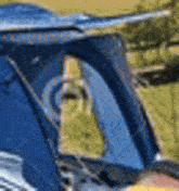 a close up of a helicopter 's windshield with a person sitting in the driver 's seat .