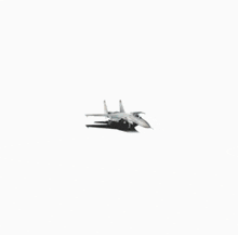 a white fighter jet with a red star on the tail sits on a white background