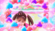 a little girl is surrounded by hearts and playing cards