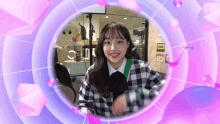 a girl in a plaid shirt is smiling in a circle with a purple background