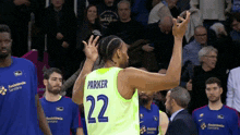 a basketball player wearing a number 22 jersey