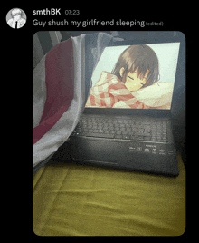 a laptop with a picture of a girl on it